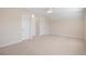 Large bedroom with neutral walls, carpeting, and two white doors at 2049 Oxford St., Myrtle Beach, SC 29577