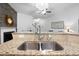 Close up of a stainless steel kitchen sink and granite countertops at 2049 Oxford St., Myrtle Beach, SC 29577