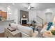 Cozy living room featuring a stone fireplace, comfortable seating, and stairs leading to the next level at 2049 Oxford St., Myrtle Beach, SC 29577