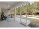 Spacious screened in porch with ceiling fan and outdoor seating at 2049 Oxford St., Myrtle Beach, SC 29577