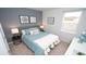 Comfortable bedroom featuring a stylish accent wall, comfortable bed, and natural light from the window at 212 Jeff Waters Circle, Longs, SC 29568