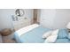 Bright bedroom featuring a modern dresser, decorative mirror, and comfortable bedding at 212 Jeff Waters Circle, Longs, SC 29568