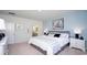 Well-lit bedroom with stylish decor and access to bathroom, creating a serene retreat at 212 Jeff Waters Circle, Longs, SC 29568