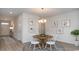 Dining room with a round table and seating for four, adjacent to the entry and hallway at 212 Jeff Waters Circle, Longs, SC 29568