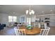 Open concept design showcasing the dining area, living room, and kitchen with backyard views at 212 Jeff Waters Circle, Longs, SC 29568