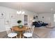 Open dining and living area featuring modern furnishings and decor with connecting bedroom at 212 Jeff Waters Circle, Longs, SC 29568