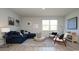 Bright living room with comfortable seating, neutral walls, and view of the outdoor space at 212 Jeff Waters Circle, Longs, SC 29568