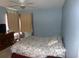 Comfortable bedroom with a ceiling fan, dresser, and ample natural light, ideal for relaxation at 2257 Huntingdon Dr. # F, Surfside Beach, SC 29575