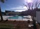 Community pool surrounded by lush landscaping, offering residents a refreshing and enjoyable outdoor amenity at 2257 Huntingdon Dr. # F, Surfside Beach, SC 29575