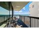 Relax on this cozy balcony offering stunning ocean views, complete with comfortable seating to enjoy the scenery at 2311 S Ocean Blvd. # 771, Myrtle Beach, SC 29577