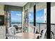 Cozy dining area showcasing ocean views through large windows and balcony doors at 2311 S Ocean Blvd. # 771, Myrtle Beach, SC 29577