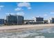 Scenic view of oceanfront hotels along a beach, under a sunny blue sky with scattered clouds at 2311 S Ocean Blvd. # 771, Myrtle Beach, SC 29577