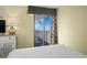 Cozy bedroom featuring dresser and lamp, leads to a balcony with an ocean view at 2311 S Ocean Blvd. # 771, Myrtle Beach, SC 29577