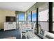 Dining area with seating for four, a TV, and ocean views through balcony doors at 2311 S Ocean Blvd. # 771, Myrtle Beach, SC 29577