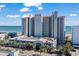 A multi-story hotel with parking garage access, palm trees, beach and ocean views under a sunny sky at 2311 S Ocean Blvd. # 771, Myrtle Beach, SC 29577
