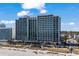 Expansive view of a high-rise oceanfront resort featuring numerous balconies, multiple floors, and a beachfront location at 2311 S Ocean Blvd. # 771, Myrtle Beach, SC 29577