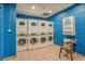 Clean and bright laundry room featuring multiple commercial-grade washer and dryer units for resident convenience at 2311 S Ocean Blvd. # 771, Myrtle Beach, SC 29577