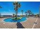 Inviting oceanfront lazy river with lush landscaping surrounded by lounge chairs at 2311 S Ocean Blvd. # 771, Myrtle Beach, SC 29577
