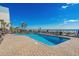 Oceanfront pool deck with blue pool, lounge chairs, and palm trees overlooking the beach at 2311 S Ocean Blvd. # 771, Myrtle Beach, SC 29577