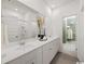 Bright bathroom featuring double vanity with modern fixtures, spacious countertop, and large mirror at 264 Warner Crossing Way, Loris, SC 29569