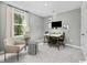 Cozy home office with ample natural light, modern décor and furniture at 264 Warner Crossing Way, Loris, SC 29569