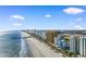 Aerial view of a beach lined with condos and commercial buildings at 2701 N Ocean Blvd. # 1857/1860, Myrtle Beach, SC 29577