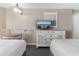 Cozy bedroom space featuring two beds, a dining area, a tv and a dresser at 2701 N Ocean Blvd. # 1857/1860, Myrtle Beach, SC 29577