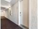 Hallway view leading to a room with textured walls and a dark colored carpeted floor at 2701 N Ocean Blvd. # 1857/1860, Myrtle Beach, SC 29577