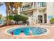 Outdoor jacuzzi tub with brick surround with two people relaxing in the water at 2701 N Ocean Blvd. # 1857/1860, Myrtle Beach, SC 29577