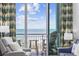 Relaxing balcony showcasing ocean views, comfortable seating, and stylish curtains at 300 N Ocean Blvd. # 324, North Myrtle Beach, SC 29582