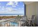 Scenic balcony featuring views of the ocean, pool, and beach, perfect for relaxing and enjoying the scenery at 300 N Ocean Blvd. # 324, North Myrtle Beach, SC 29582