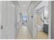 Inviting condo hallway leading to oceanfront balcony, kitchen, and bathroom at 300 N Ocean Blvd. # 324, North Myrtle Beach, SC 29582