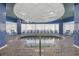 Indoor hot tub surrounded by blue tiles, with comfortable seating and natural light at 300 N Ocean Blvd. # 324, North Myrtle Beach, SC 29582
