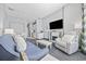 Open-concept living room with a dining area, kitchen, TV, fireplace, and comfortable seating at 300 N Ocean Blvd. # 324, North Myrtle Beach, SC 29582
