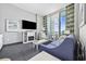 Inviting living room with a TV, decorative fireplace, comfortable seating, and a balcony with scenic views at 300 N Ocean Blvd. # 324, North Myrtle Beach, SC 29582