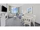 Comfortable living room with sofa, recliner, and balcony access with an ocean view at 300 N Ocean Blvd. # 324, North Myrtle Beach, SC 29582