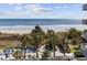 Breathtaking ocean view from the property with beach access and palm trees at 300 N Ocean Blvd. # 324, North Myrtle Beach, SC 29582