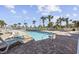 Inviting outdoor pool with plenty of lounge chairs and a nearby hot tub at 300 N Ocean Blvd. # 324, North Myrtle Beach, SC 29582