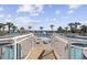 Stunning oceanfront pool area with palm trees, lounge chairs, and a splash fountain at 300 N Ocean Blvd. # 324, North Myrtle Beach, SC 29582