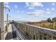 Convenient boardwalk access to the beach with outdoor showers for rinsing off sand at 300 N Ocean Blvd. # 324, North Myrtle Beach, SC 29582