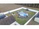 Drone shot of the fenced backyard featuring an above-ground pool, seating, and a patio area at 304 Carolina Springs Ct., Conway, SC 29527