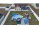 Aerial view of backyard with an in-ground pool, outdoor seating, barbecue, lounge area, and mature trees at 304 Carolina Springs Ct., Conway, SC 29527