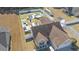 A high-angle view of a home featuring a fenced backyard, patio seating, in-ground pool, and green spaces at 304 Carolina Springs Ct., Conway, SC 29527