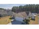 A high-angle view of a home with manicured landscaping around the driveway and front yard at 304 Carolina Springs Ct., Conway, SC 29527