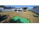 A well-designed backyard for leisure, featuring a putting green, pool, and cozy seating area at 304 Carolina Springs Ct., Conway, SC 29527
