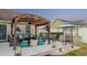 Charming backyard with a pergola featuring seating, a hot tub, and an outdoor kitchen perfect for entertaining at 304 Carolina Springs Ct., Conway, SC 29527
