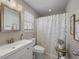 Bright bathroom featuring a modern sink, shower with decorative curtain, and neutral color palette at 304 Carolina Springs Ct., Conway, SC 29527