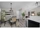 Dining area adjacent to the kitchen and living room with modern decor at 304 Carolina Springs Ct., Conway, SC 29527