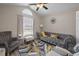Stylish living room featuring vaulted ceilings, a tufted sofa, modern decor, and lots of natural light at 304 Carolina Springs Ct., Conway, SC 29527