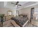 Spacious main bedroom featuring a tray ceiling, hardwood floors and neutral decor at 304 Carolina Springs Ct., Conway, SC 29527